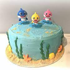 I really love this cute and simple design just right for a shark loving kiddo. Diy Baby Shark Cake Shark Birthday Cakes Shark Cake Homemade Birthday Cakes