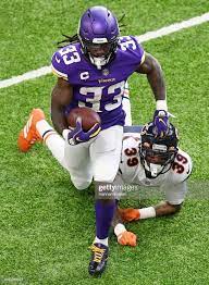 Dalvin Cook Of The Minnesota Vikings Runs With The Ball As Eddie Minnesota Vikings Vikings Football Vikings
