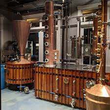 Bombay sapphire gin, our world famous gin in its distinctive blue bottle. Blue Clover Distillery Reset Studios