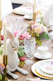 A botanical color palette is elevated with monochromatic green tones and pops of blush pink in the centerpiece and gold metallic 11. Easter Table Decorations That Will Wow Your Guests