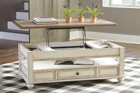 Constructed with chic design and clean lines, the marion coffee table from ashley elevates your home's décor in style and functionality. Realyn White Brown Lift Top Cocktail Table On Sale At American Furniture Of Slidell Serving Slidell La