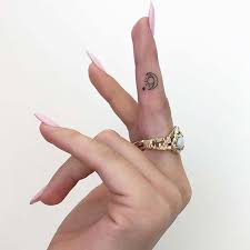 23 Most Beautiful Sun And Moon Tattoo Ideas Small Finger Tattoos Tiny Tattoos For Girls Hand Tattoos