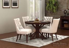 Dinner Parties Are An Intimate Affair Round Dining Tables Will Keep That Cozy And Comfortable 4 Seater Dining Table Round Dining Table Sets Black Dining Room