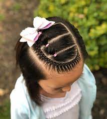 Dutch Braid With Elastic Sections On The Side Into A Messy Bun Super Cute Bow Is Fr Kids Hairstyles Lil Girl Hairstyles Braids Kids Braided Hairstyles