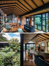 An open plan kitchen faces the dining area and flows through to a living room making it perfect for entertaining. This Triangular Shaped House Makes Room For An Interior Garden