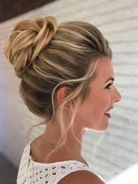 A bun hairstyle is usually associated with the hair being pulled back completely, exposing the forehead. Wedding Hairstyle High Bun On Highlighted Blonde Hair Promhairupdotutorial Bridesmaid Hair Bun Bridesmaid Hair Updo High Bun Hairstyles
