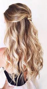 Twisted flips are a common way to do half up half down curly hairstyles since they are not only easier to do but you can also take them to a next level by pinning a floral or bejeweled accessory. Balayage Half Up Half Down Curly Hair Gorgeoushair Down Hairstyles For Long Hair Hair Styles Curly Hair Styles