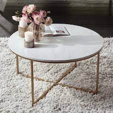 An oval one with an architectural frame functions well as a statement piece, while a square silhouette on a wood base delivers understated appeal. Aurelia 36 Wide Faux Marble And Gold Modern Coffee Table 24w56 Lamps Plus