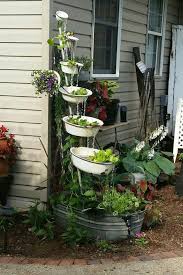 Let your garden be an expression of your personality. Jill Dayton Pinterest Created The Awesome Water Feature From Enamel Basins And Galvanized Water Features In The Garden Front Yard Garden Backyard Landscaping