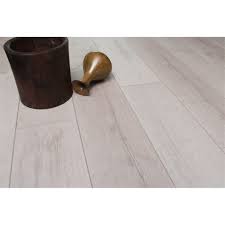 White wood like gloss laminate flooring creates a clean and minimalist look that will complement any colour. Smart Flooring Medina 12mm 1 77sqm Pearl White Laminate Flooring Bunnings Australia
