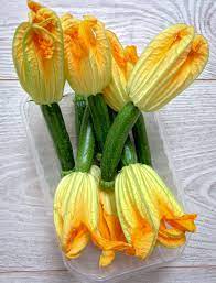 Unless you grew up in an italian household, eating zucchini flowers (also called zucchini blossoms) may seem like a foreign concept to you. French Fridays With Dorie Shrimp Filled Zucchini Blossoms Eat Live Travel Write