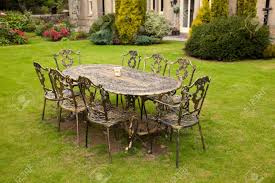 Cast iron is produced by heating iron with a high carbon content until it liquefies, and then casting the iron into moulds of compressed sand. Old Fashioned Gold Colored Cast Iron Table And Eight Chairs On Stock Photo Picture And Royalty Free Image Image 7615043