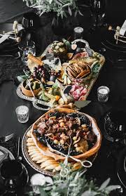 Surround the pot with dry ice and water (look for dry. Chic Black Halloween Dinner Party Table Setting Ideas With Photos Halloween Dinner Halloween Party Dinner Halloween Dinner Party Menu