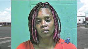 Woman facing child neglect charge after allegedly throwing baby into car