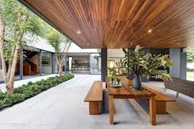 From design to delivery, we help make your space look beautiful. Steel Concrete And Stone Home With Central Courtyard Architecture Wooden Ceiling Design Outdoor Dining Spaces