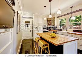 Led by owner, gail o'rourke, our dedicated team designs and skillfully manages installations in collaboration with premier architects and builders to ensure all parties are on point for every project. White Kitchen With Wooden Counter Top Island White Kitchen Cabinet With White Appliances Kitchen Island With Wooden Counter Canstock