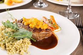In the bottom of a large bowl, whisk together the lemon zest, lemon juice, olive oil, mustard, smoked paprika, salt, and pepper. Light Smoked Duck Breast Served With Orange Chutney And Pearl Couscous Flavoured With Pesto Picture Of Rp9 Tartu Tripadvisor