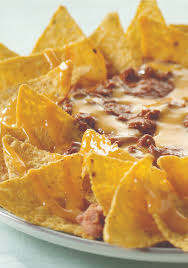 Nacho Platter Ole Canned Chili And Cheese Sauce Are Heated And Poured Over Refried Beans And Tortilla Chips In This Savo Food Food Platters Appetizer Recipes