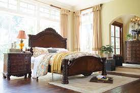 A marble parquetry top tops off the opulence. North Shore Queen Panel Bed Ashley Furniture Homestore