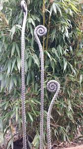 Repurposed Rebar Fiddlehead Fern Garden Stakes Would Be Great For Hose Guards Garden Art Sculptures Garden Art Yard Art