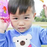 A child counts his eggs after participating in an egg