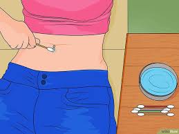 How To Care For A New Navel Piercing With Pictures Navel Piercing Belly Button Piercing Care Bellybutton Piercings