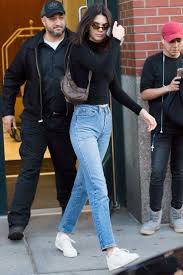 Who made kendall jenner's black flat sandals, sunglasses, handbag, and knit crop top? Kendall Jenner Bares Her Midriff In A Hot Pink Crop Top Kendall Jenner Outfits Casual Kendall Style Kendall Jenner Street Style