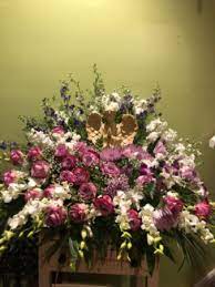 Funeral arrangements, wreaths, posies, sprays and other flower tributes suitable for a funeral ceremony will be available here. Angel Sympathy Purple Arrangement Funeral Flowers Roma Florist Free Delivery Order Online In Oakville Ct Roma Florist Free Delivery Order Online
