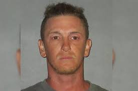 Man arrested after his brother was found dead under truck