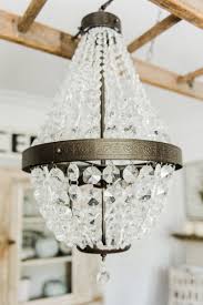 The essence of a contemporary dining room is found in its decorative lighting and furniture. The Chandeliers Are Hung Liz Marie Blog