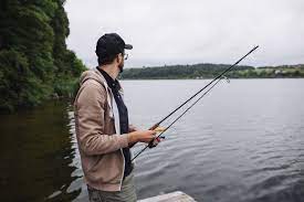 Download Side View Of Young Man Holding Fishing Rod For Free Boat Silhouette Fish Silhouette Fishing Rod
