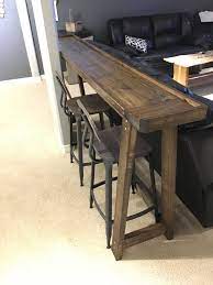 After installing a projector in my basement we had a lot of fun having friends and family over. Bar Height Table Behind The Couch Rec Room Decor Home Decor Wood Sofa
