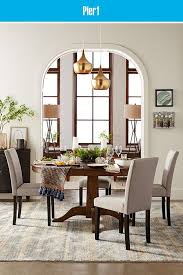 Unwind While You Dine With The Modern Relaxed Style Of Our Heritage Round Extension Dining Table A Round Dining Room Round Dining Room Table Gray Dining Chairs