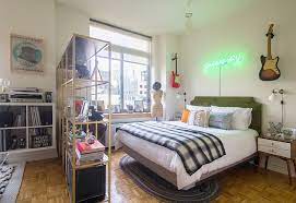 New york themed bedroom with red curtains and a photo of new york city on the wall. 25 Most Beautiful Small Bedrooms In Homes Across New York City