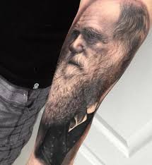 But it was his animal tattoos in a simple, striking sketch style that really caught our attention. Realistic Darwin Portrait On Forearm