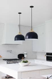 Let your plates, bowls, and more do the talking with these open shelves that prove white on white on white can totally work. Black And White Kitchen With Brushed Gold Hardware Transitional Kitchen