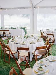 Simple Linens Paired With Mahogany Folding Chairs And The Green Grass Created A Beautiful Setting At This Lion Square Lo Wedding Tent Tent Decorations Wedding