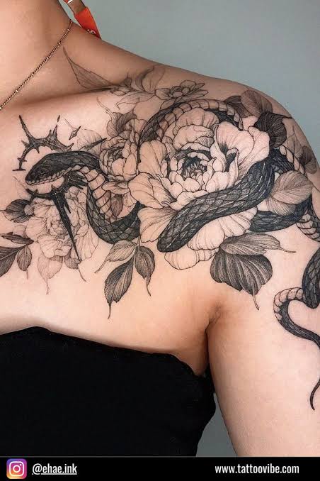 Flower and snake shoulder tattoo