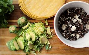Add in the shaved brussels sprouts, another drizzle of olive oil, salt, and lime juice. Crispy Black Bean Feta Tacos With Brussels Sprout Slaw Dinner With Julie