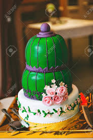 Specialising in decadently delicious cakes, chocolates and patisseries, the mandarin cake shop has been catering hong kong's sweet tooth for over 45 years. Green Purple Wedding Cake With Pink Flowers In An Oriental Style Stock Photo Picture And Royalty Free Image Image 54810778