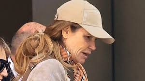 Elle Macpherson, 60, lets her natural beauty shine through as she goes  makeup free in Sydney for a shopping spree with father Peter Gow