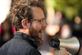 A group of about 200 protestors gathered outside t…