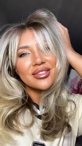 I spent the last 2 years letting my natural color grow in and cutting off  the old. After 2 years we officially cut off the last of the solid blonde  and I've