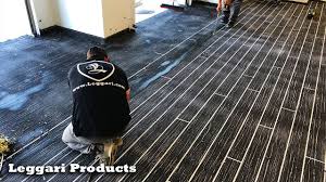 Each floor kit comes with enough primer, 100% solids epoxy, and metallics to create a truly one of a kind high end floor. Faux Black Wood Planks In A Garage Giving It A Complete Transformation Coated Using Concrete Overlay Youtube