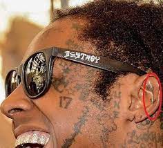 The new tattoo is a tiny drawing of a dynamite plunger—the . Lil Wayne S 89 Tattoos Their Meanings Body Art Guru