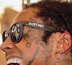 The mixed imagery of his chosen body art. Lil Wayne S 89 Tattoos Their Meanings Body Art Guru