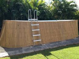 How To Decorate And De Boring An Above Ground Pool Offbeat Home Life Above Ground Pool In Ground Pools Above Ground Pool Landscaping