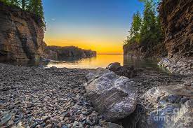 Except, the water looks imported from the carribean. Sunset Black Rocks Marquette Michigan 7631 Photograph By Norris Seward