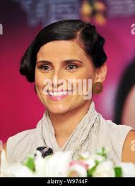 Canadian singer Nelly Kim Furtado smiles during a press conference for her  upcoming concert in Taipei, Taiwan, 10 August 2012 Stock Photo