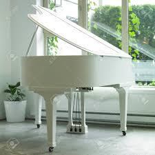 The superb sound of this small grand defies its 155 cm of length, thanks to the steinway design. White Baby Grand Piano In A White Room Stock Photo Picture And Royalty Free Image Image 32694022